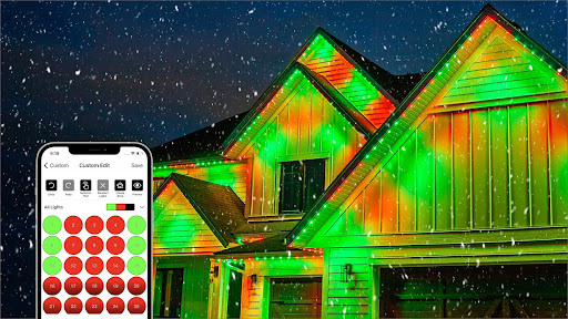 A house is lit up in red and green. There is a phone with the app open to the Gemstone Lights Hub App in the foreground.